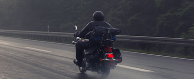 Motorcyclist driver in rain
