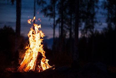A photo of a campfire at night.