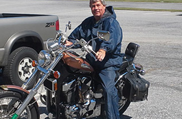 Motorcycle rider with rain jacket