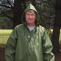 man in a hooded waterproof parka