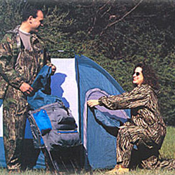 couple camping in camo rain suits